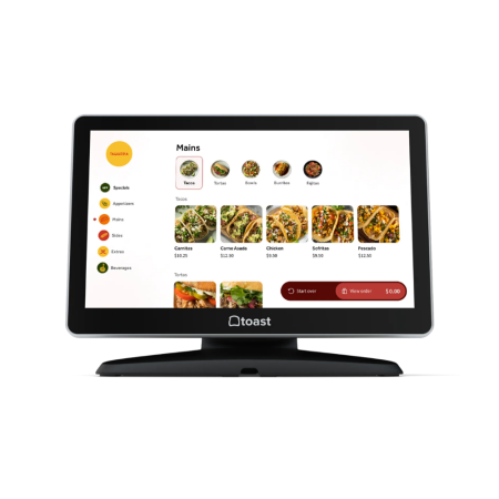 Toast self-ordering kiosk with touchscreen display showing taco menu and pricing for quick-service restaurants